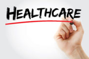 Hand writing Healthcare with marker, health concept background